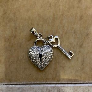 Heart and key pendant/charm looks nice on a chain. Chain not included